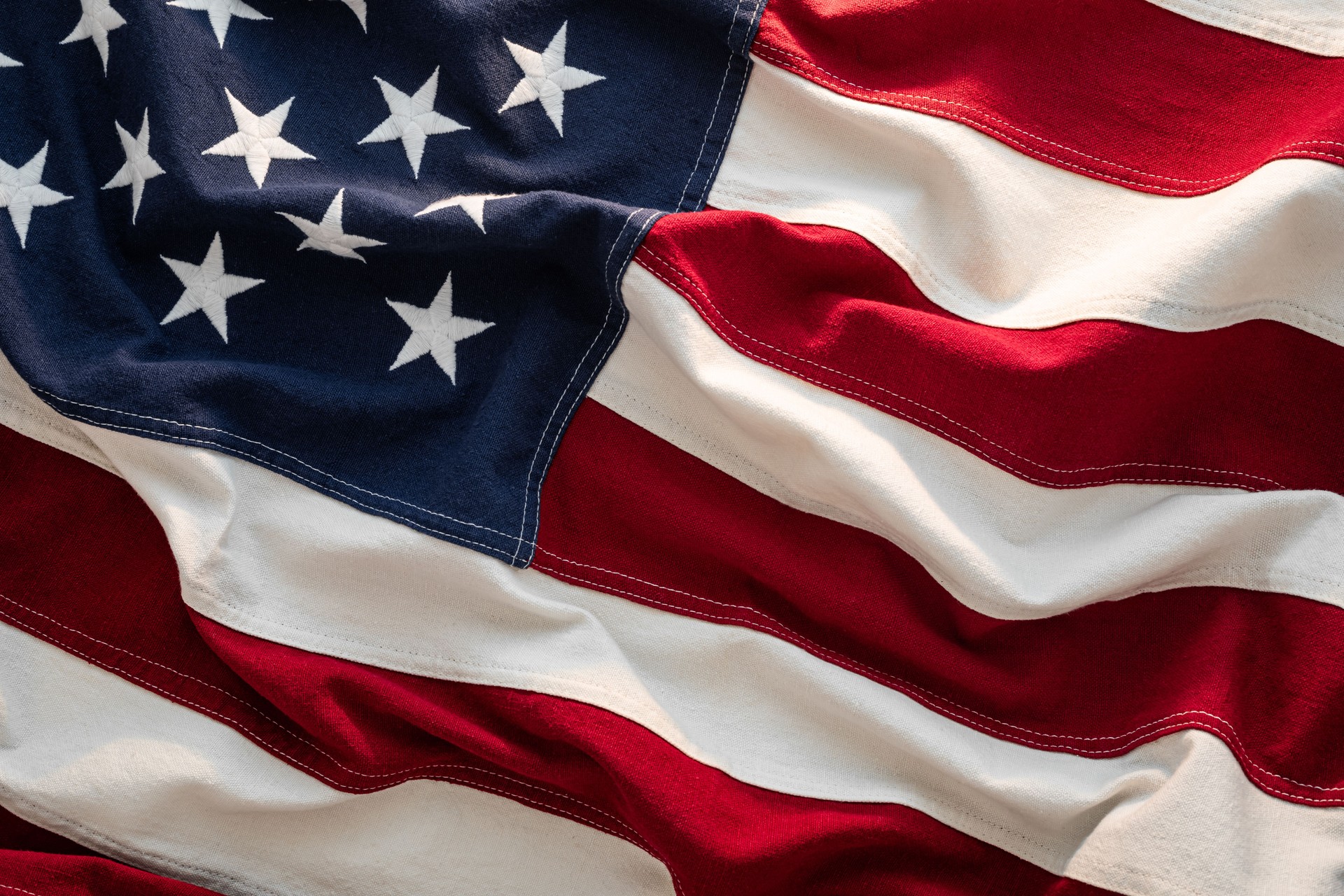 Closeup Waving American US Flag in the Sunlight